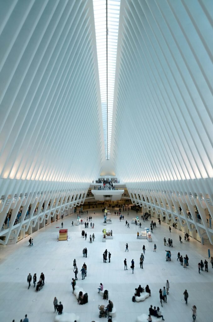 services-2 Modern architectural view of the Oculus in NYC, showcasing its futuristic design and bustling interior.